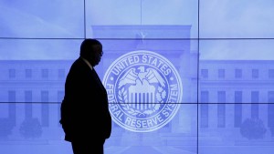 A security guard walks in front of an image of the Federal Reserve following the two-day Federal Open Market Committee (FOMC) policy meeting in Washington, DC, U.S. on March 16, 2016. REUTERS/Kevin Lamarque/File Photo