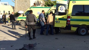 Emergency personnel and security forces stand next to ambulances outside the Swiss Inn hotel in the Egyptian town of El-Arish, in the Sinai peninsula, following an attack on the hotel by two suicide bombers and a gunman on November 24, 2015. The attackers killed four people, including a judge, in the assault on the hotel hosting judges overseeing Egypt's parliamentary polls, the government said. AFP PHOTO / STR / AFP / -        (Photo credit should read -/AFP/Getty Images)